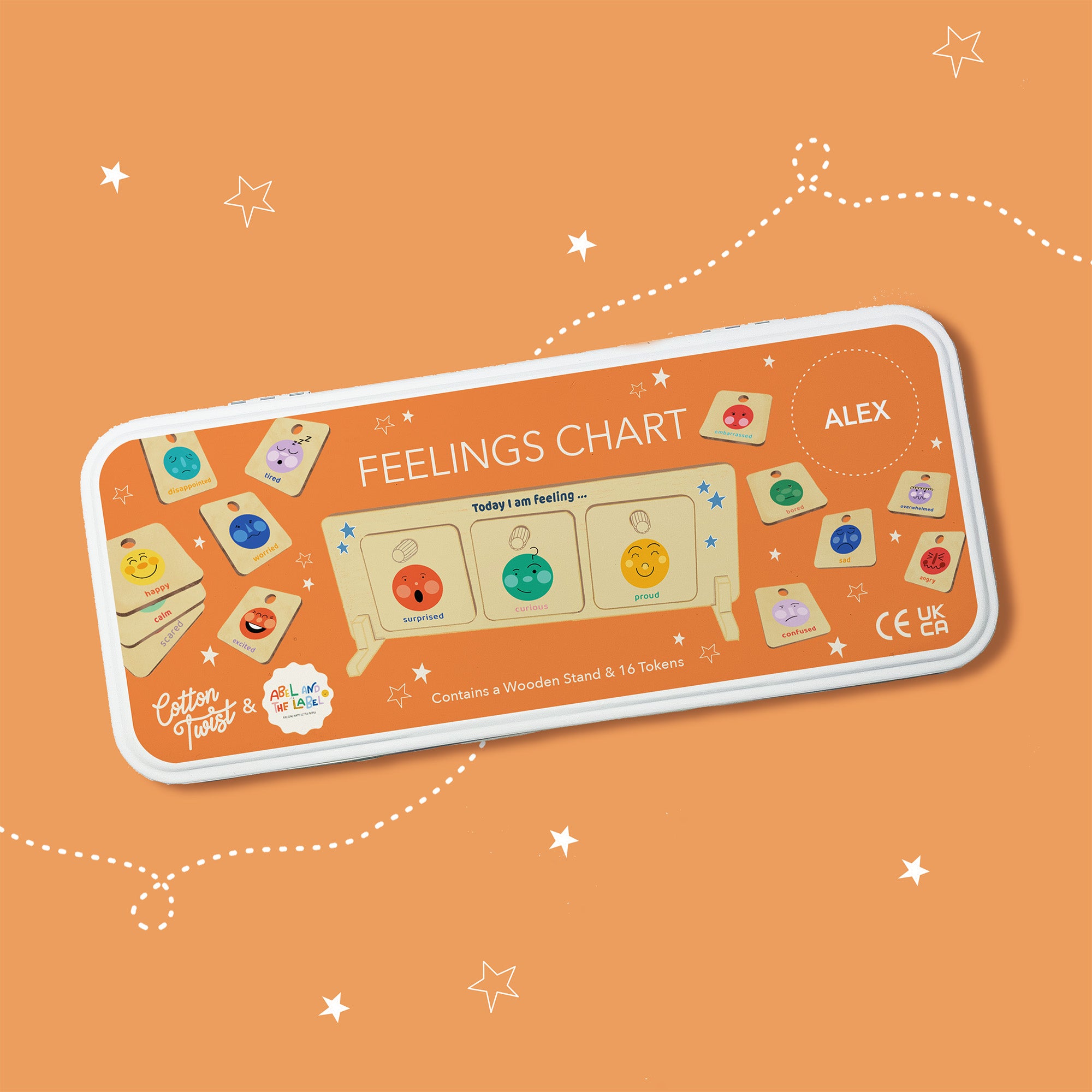 Orange tin packaging for feelings chart, showing the wooden stand and emotion tokens.