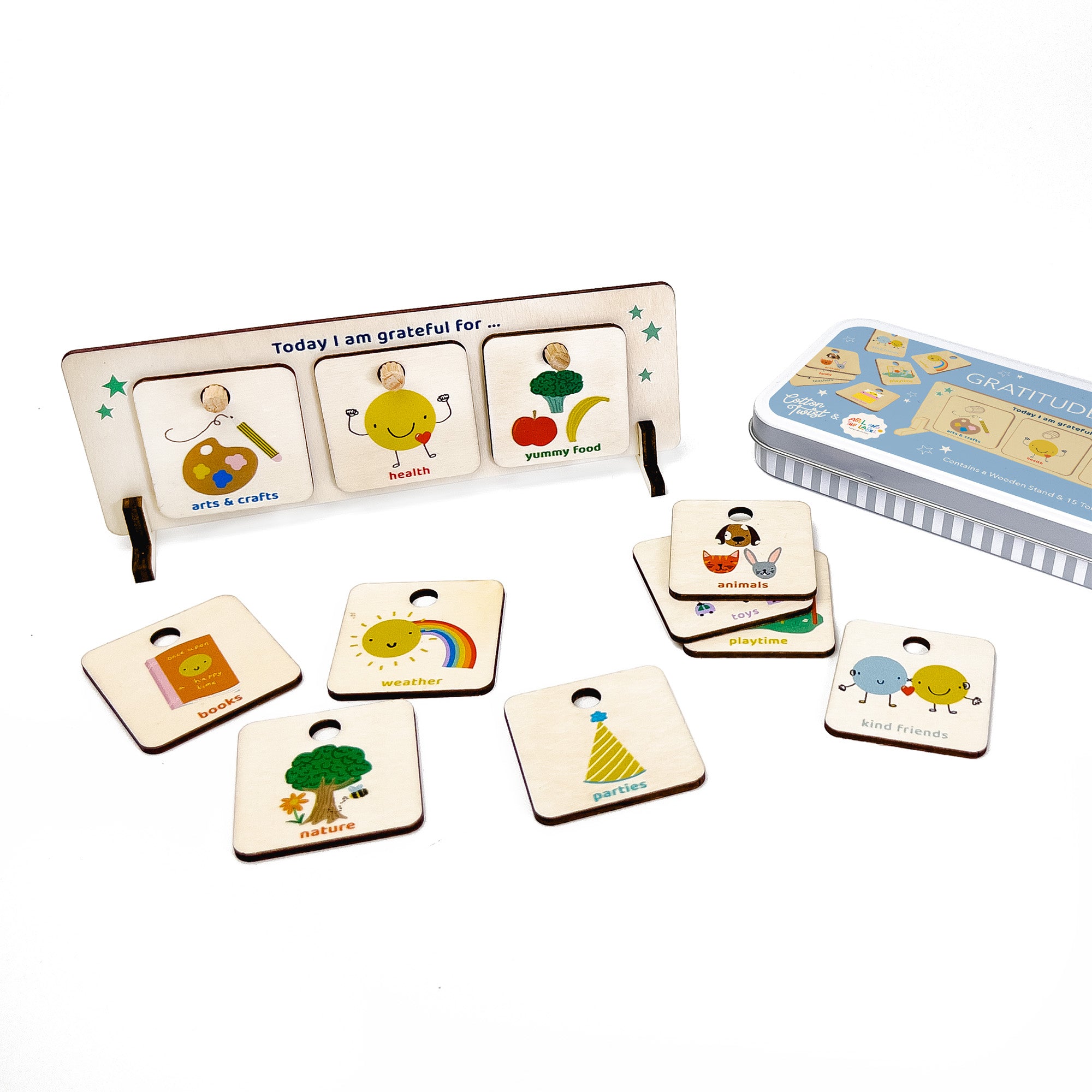 Wooden gratitude chart with three tokens slotted in and additional illustrated tokens displayed around it.