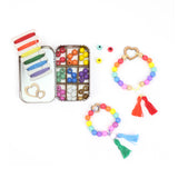 open gift tin showing selection of colourful beads and bracelets